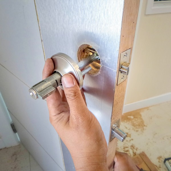 Emergency locksmith unlocking a safe for a business in Charleston, SC.