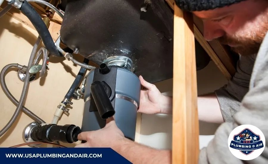 Plumber fixing a clogged garbage disposal drain in a Las Vegas property